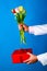 Couple, relationships and people concept - man holding flowers and gift. Unexpected moment in routine everyday life