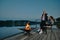 Couple is relaxing in the evening silence on the pier