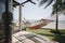 Couple relaxing in a hammock by the beach