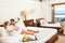 Couple Relaxing In Hotel Room Wearing Robes