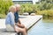 Couple relaxing at poolside