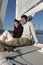 Couple Relaxing On Sailboat