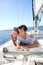 Couple relaxing on sailing deck