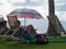 Couple relaxing under colorful umbrella