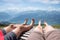 Couple relaxing at wooden sunbed, Niederhorn mountain, view to bernese alps