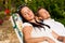 Couple resting in deck chair in summer