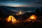 A couple rests by a campfire, their tent glowing under starlight