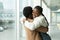 Couple reunion in airport: african female met hug boyfriend arriving after vacation or trip abroad