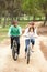 Couple riding bicycle in park