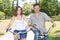 Couple riding bicycles outside in healthy lifestyle fun vacation concept