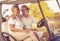 Couple are riding in a golf cart and talking