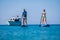 Couple riding SUP stand up paddle on vacation