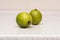 Couple of ripe green limes on the table