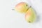 Couple of Ripe Organic Pears in Pastel Green Yellow Red Colors on White Wood and Linen Fabric. Elegant Minimalist Japanese Style