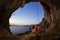 Couple of rock climbers resting in cave