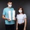 Couple with rolls of toilet paper. Widespread pandemic
