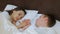 Couple romance closeness love touch hold hand bed