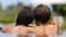 Couple romantic relaxing together in infinity swimming pool