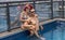 Couple at a roof top swimming pool