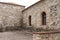 A couple of rounded arch windows of a medieval building with bricks Madeira,Portugal