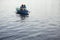 Couple In Rowboat At Lake