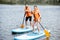 Couple rowing on the stand up paddleboard