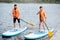 Couple rowing on the stand up paddleboard