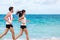 Couple runners running training cardio on beach