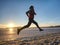 Couple runners running in winter nature. Frozen river