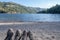 Couple`s feet point of view on a beach in Geres National Park