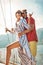 Couple on a sail boat in the summer.
