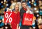 Couple with sale and discount sign on shopping bag