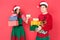 Couple in santa hats with gifts