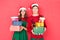 Couple in santa hats with gifts