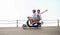 Couple, scooter and road trip for fun, adventure and vacation or holiday, romance and date together. Happy people