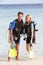 Couple With Scuba Diving Equipment Enjoying Beach Holiday