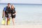 Couple With Scuba Diving Equipment Enjoying Beach Holiday