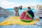 couple at the sea beach inflate mattress and inflatable ring