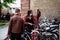 Couple securing their bibles in the large bike parking in French city