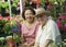 Couple Selecting Flowers In Nursery