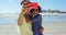 Couple, selfie and kiss on beach for social media on holiday for connection, adventure or traveling. Man, woman and