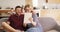 Couple, selfie and kiss on sofa in home with tablet, love and romance for post, update or video on social media app. Man