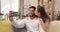 Couple, selfie and living room sofa with a kiss and happiness in a home. Happy, love and care in a house lounge on a