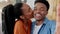 Couple selfie, love and black couple sharing kiss during influencer streaming video for social media. Portrait and face