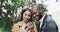 Couple, selfie in park and date with interracial people outdoor for romance and photography. Love, care and smile in