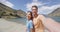 Couple selfie video in nature landscape on New Zealand travel by lake Hawea
