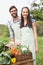 Couple selling organic vegetables at market