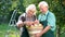 Couple of senior gardeners smiling.