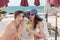 Couple Sharing Drink on Deck of Beach Resort