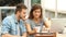 Couple shopping online in a coffee shop